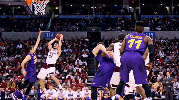 Mar 20, 2016; Oklahoma City, OK, USA; Texas A&M Aggies guard Alex Caruso (21) shoots against Northern Iowa Panthers guard Wyatt Lohaus (33) in the first half during the second round of the 2016 NCAA Tournament at Chesapeake Energy Arena.